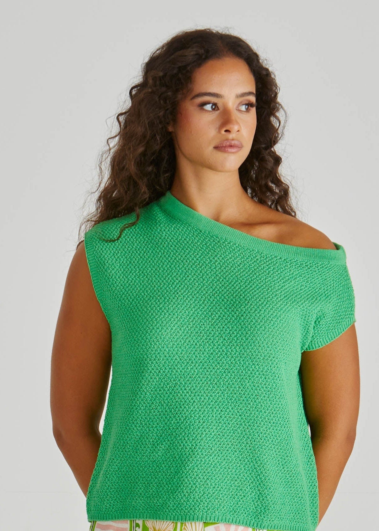 Lady wearing the SASS Jaci Knit Top in green with asymmetrical neckline and moss knit stitch detail. Available at Loloma Living, Tamborine Mountain - SASS Stockist.