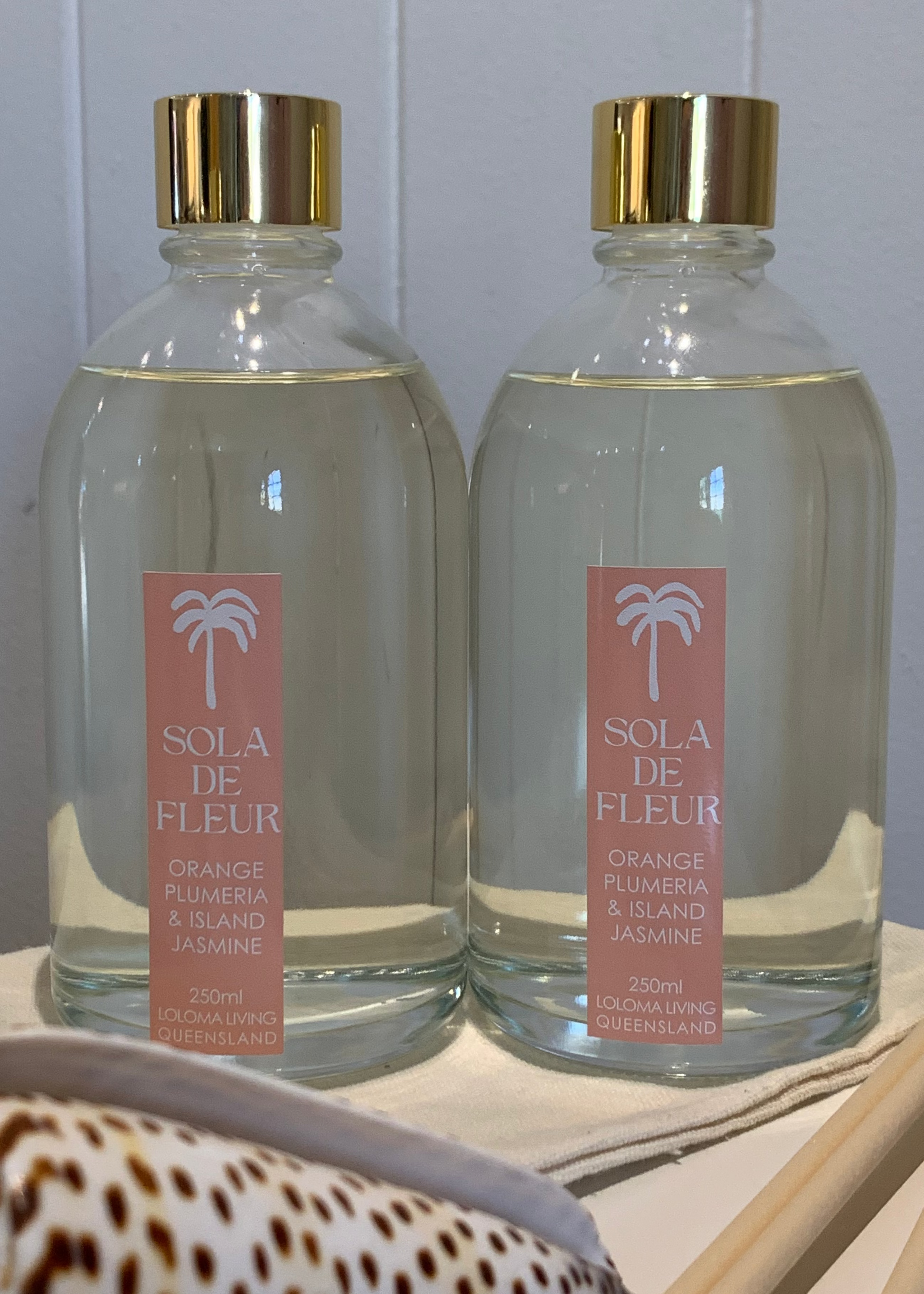 Loloma Living Home Reed Diffuser Fragrance Sola De Fleur glass bottles.