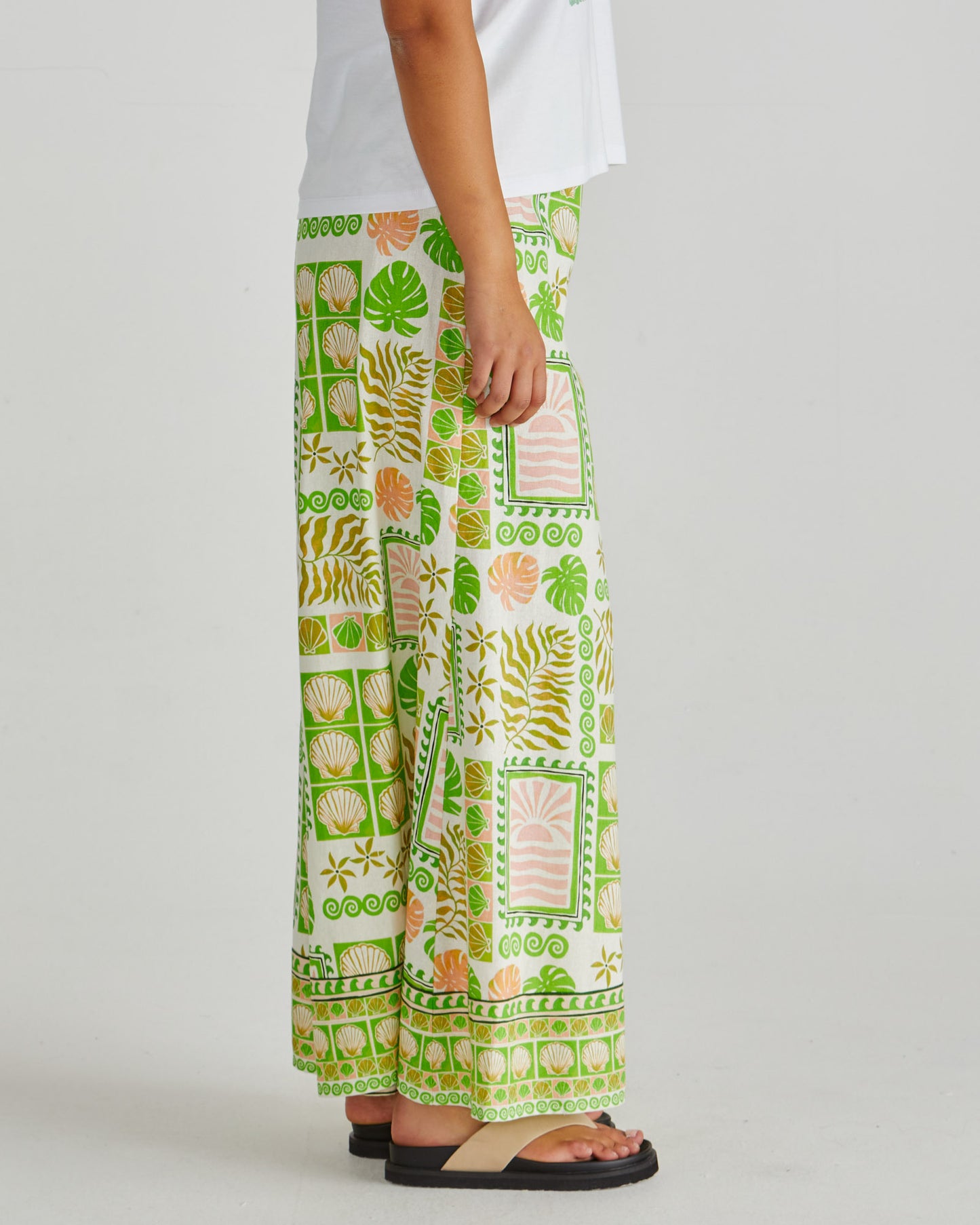 Side view of the SASS Emmett Wide Leg Pant in tropical shell print with flat front and side pockets. Available at Loloma Living, Tamborine Mountain.