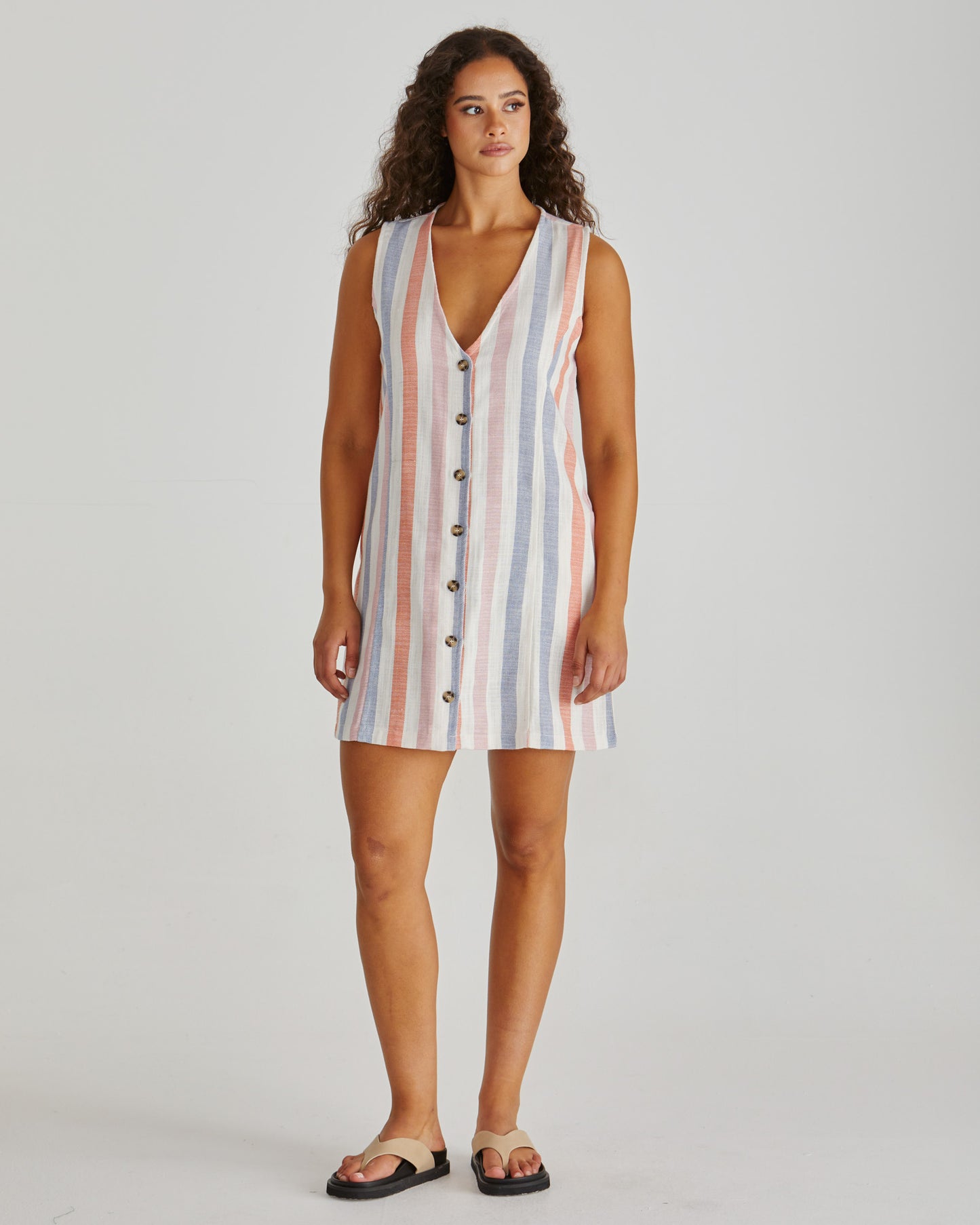 Front view of Lady wearing the SASS Travis Vest Dress in stripe with princess seam detail and side pockets. Linen combination.  Available at Loloma Living, Tamborine Mountain. Stockist of SASS and Betty Basics.