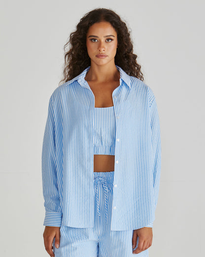 Lady wearing the SASS Alani Shirt in Blue White Stripe seersucker with concealed placket and dropped shoulder. Available at Loloma Living, Tamborine Mountain - stockist of SASS and Betty Basics.