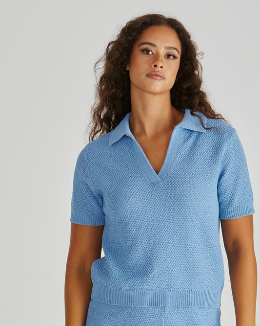 Lady wearing the SASS Aubrie Knit Polo in Blue. Available at Loloma Living, Tamborine Mountain - stockist of SASS and Betty Basics.