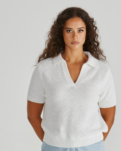 Lady wearing the Aubrie Knit Polo in White.  Giving vintage sporty style. Elegant knit top. Available at Loloma Living in Tamborine Mountain- stockist of SASS and Betty Basics.