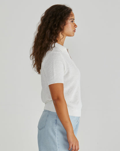 Side view of Lady wearing the SASS Aubrie Knit Polo in White.  Giving vintage sporty style. Elegant knit top. Available at Loloma Living in Tamborine Mountain- stockist of SASS and Betty Basics.
