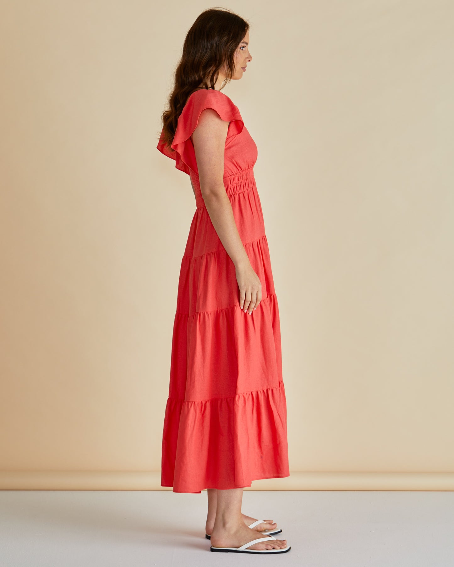 Red Sadie Betty Basics dress available at Loloma Living TAmborine Mountain. Betty Basics and SASS Stockist Loloma Living. Side view of lady wearing dress.
