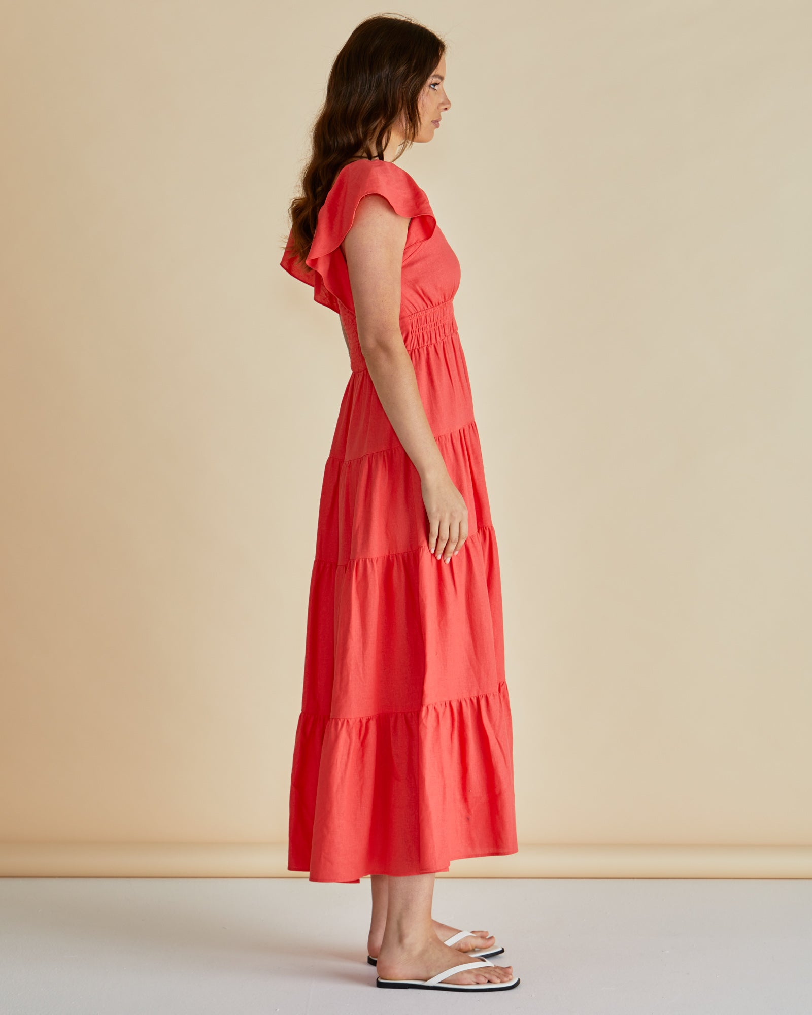 Red Sadie Betty Basics dress available at Loloma Living TAmborine Mountain. Betty Basics and SASS Stockist Loloma Living. Side view of lady wearing dress.