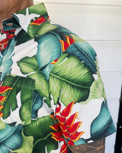 man wearing island shirt bula shirt showing a close up of the sleeve and collar in a tropical print. Available at Loloma Living Tamborine Mountain.