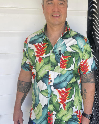 Man wearing a colourful tropical island shirt. Made in Fiji mens shirt. Available at Loloma Living Tamborine Mountain.